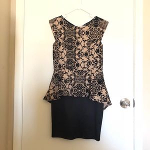 Peplum pencil dress in nude and black